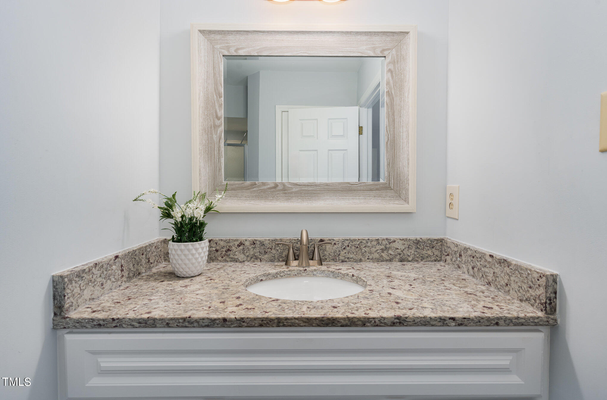 5515 Hamstead Crossing Raleigh, NC 27612 - Photo 10 of 17 a bathroom with sink granite and mirror