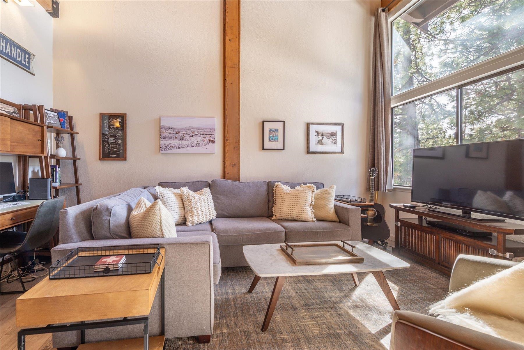 6090 Rocky Point Truckee, CA 96161 - Photo 1 of 28 a living room with furniture and a flat screen tv