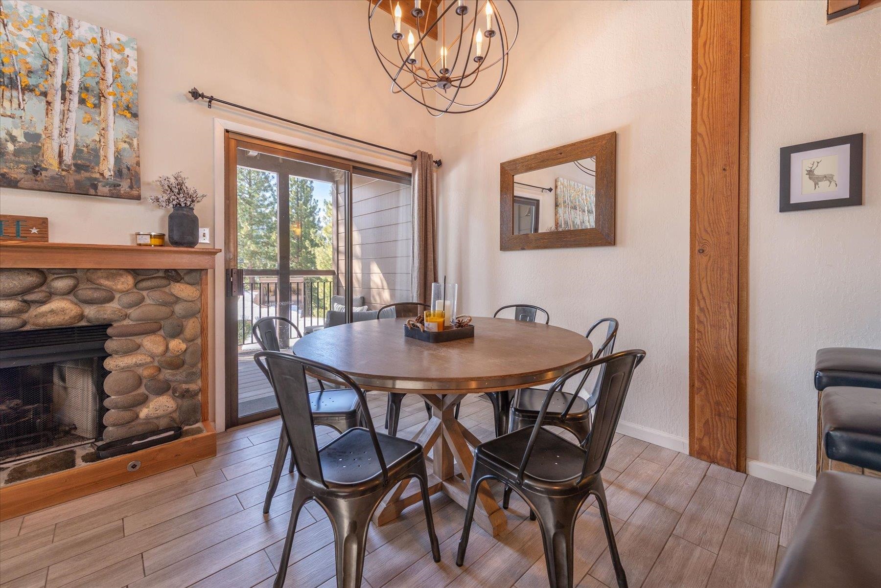 6090 Rocky Point Truckee, CA 96161 - Photo 12 of 28 a view of a dining room with furniture window and wooden floor