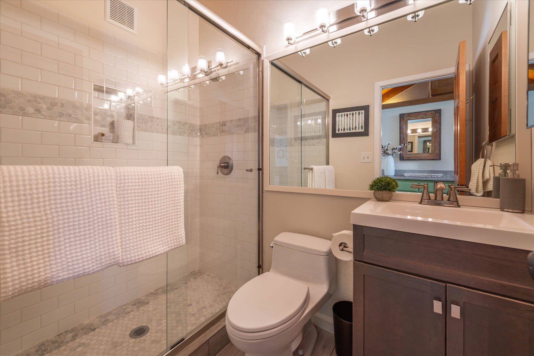 6090 Rocky Point Truckee, CA 96161 - Photo 14 of 28 a bathroom with a sink a toilet and shower