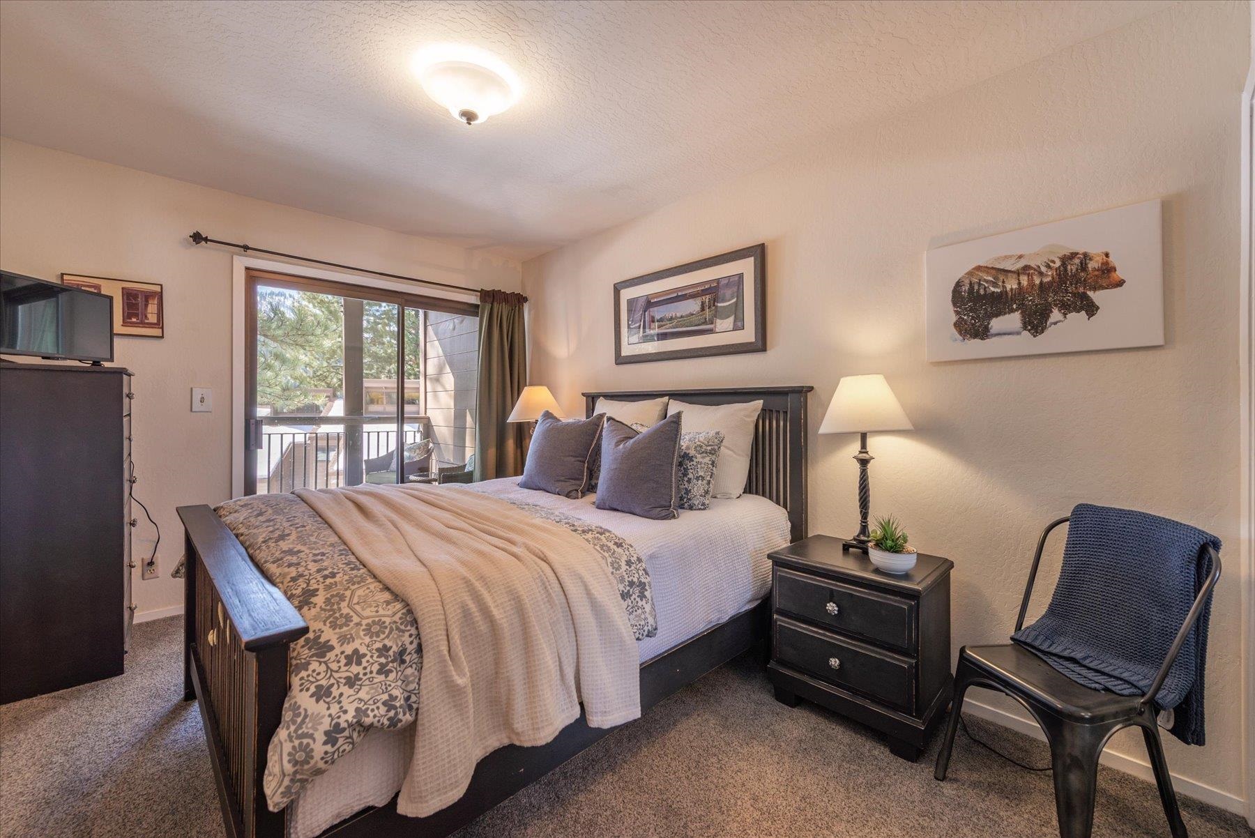 6090 Rocky Point Truckee, CA 96161 - Photo 16 of 28 a bedroom with a bed and a chair