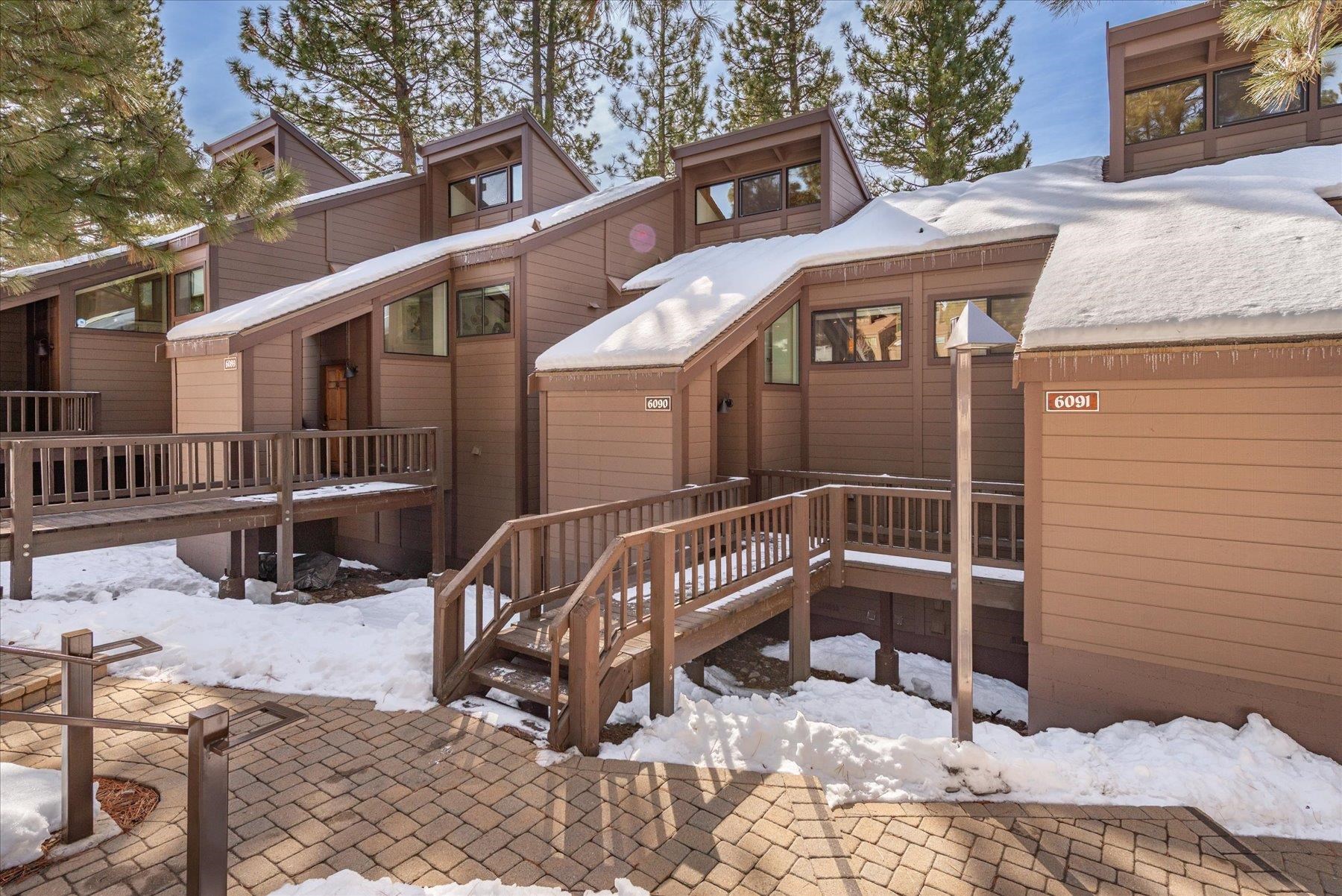 6090 Rocky Point Truckee, CA 96161 - Photo 2 of 28 a view of a house with a wooden bench in a patio