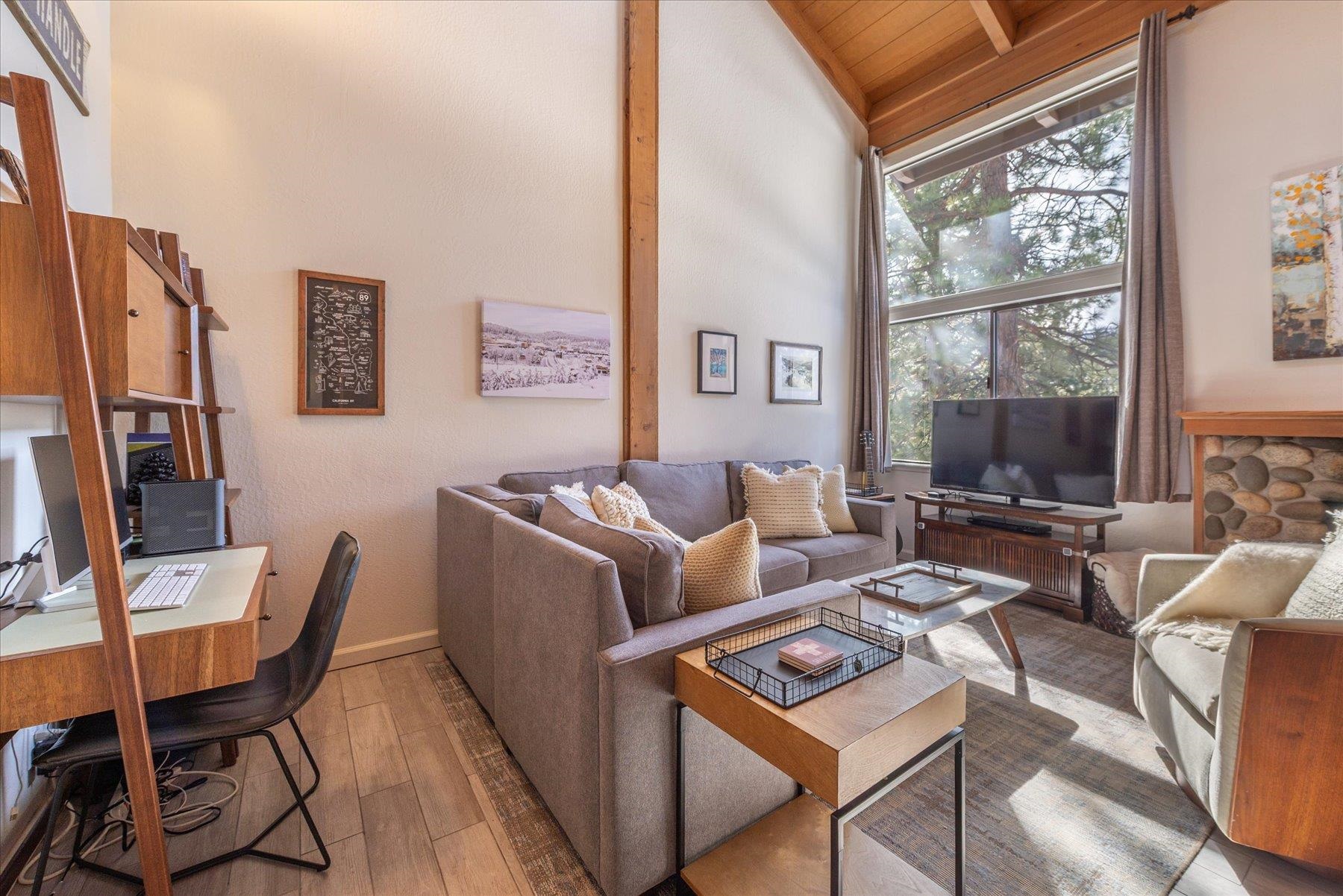 6090 Rocky Point Truckee, CA 96161 - Photo 4 of 28 a living room with furniture a large window and a flat screen tv