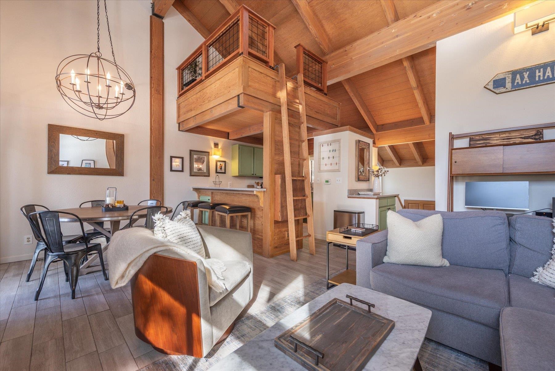 6090 Rocky Point Truckee, CA 96161 - Photo 5 of 28 a living room with furniture a wooden floor and next to a window