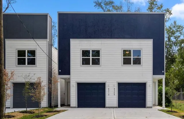 a front view of a house with yard
