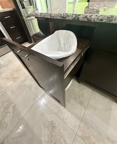 a roof deck with a table and a chairs