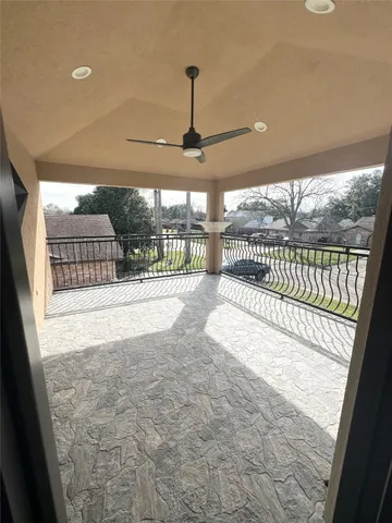 a view of an empty room and a window