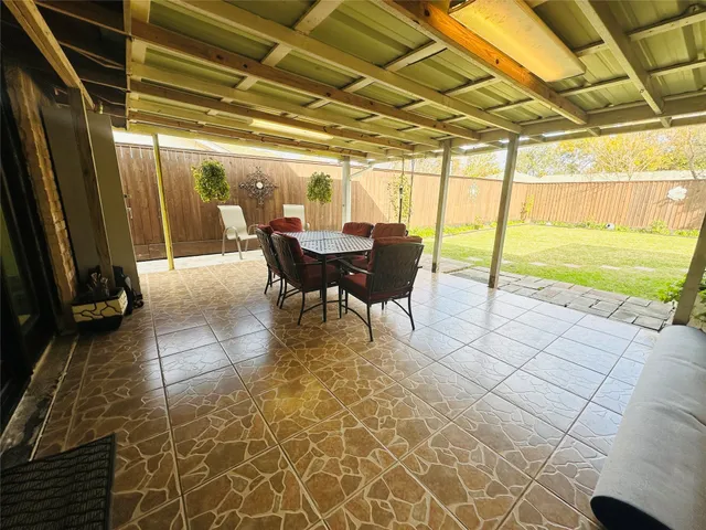 a view of a porch with furniture