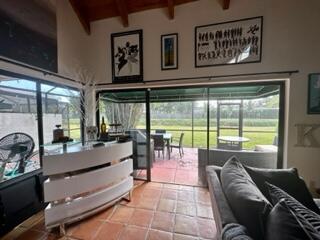 6170 Vía Tierra Boca Raton, FL 33433 - Photo 1 of 13 a living room with furniture and a large window