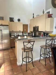 6170 Vía Tierra Boca Raton, FL 33433 - Photo 2 of 13 a kitchen with stainless steel appliances a stove a sink and a refrigerator