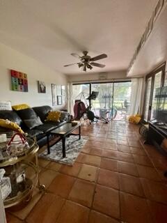 6170 Vía Tierra Boca Raton, FL 33433 - Photo 7 of 13 a living room with lots of furniture and a large window