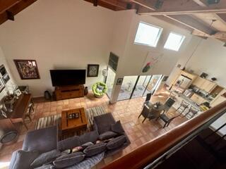 6170 Vía Tierra Boca Raton, FL 33433 - Photo 8 of 13 a room with furniture and a flat screen tv