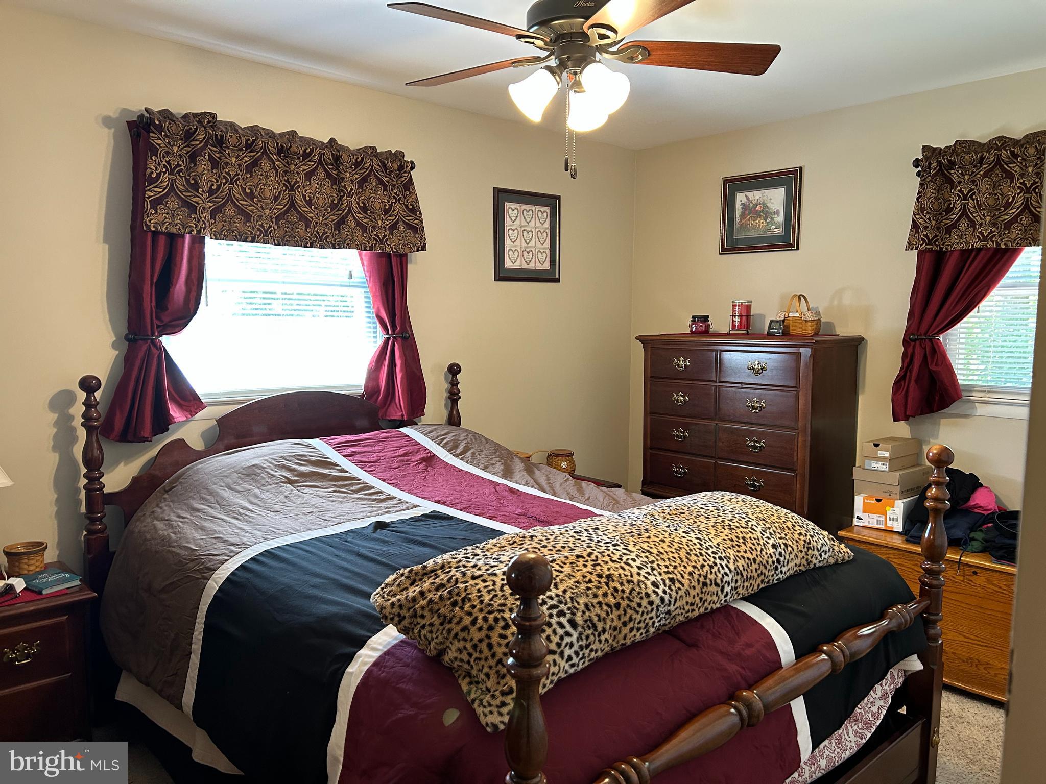 259 Hoffman Road Gettysburg, PA 17325 - Photo 8 of 23 a bedroom with a bed and a chandelier