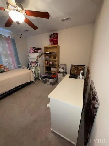 a bedroom with bed and window