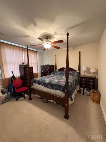 a bedroom with furniture and a chandelier