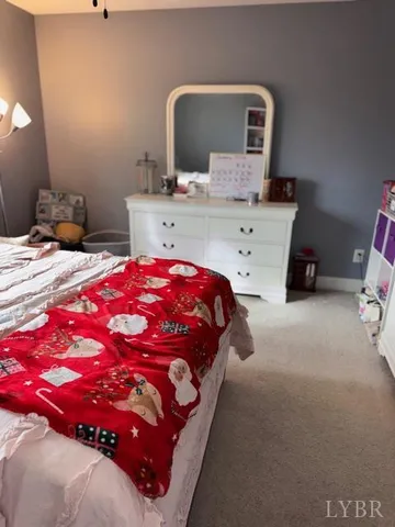 a bedroom with a bed and a mirror