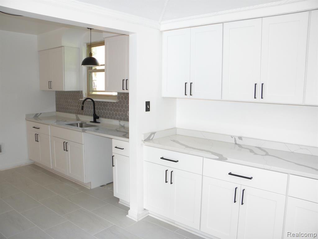 3914 Balfour Road Detroit, MI 48224 - Photo 3 of 24 White shaker-style cabinetry with matte black hardware