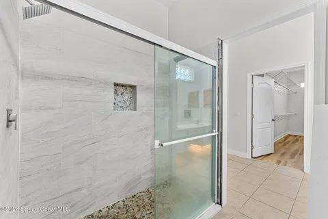 an aerial view of a house with a swimming pool