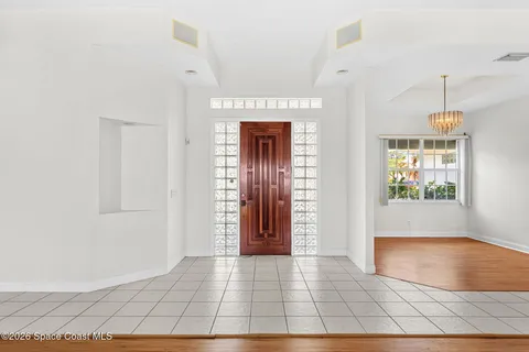 a view of a dining room with furniture and window