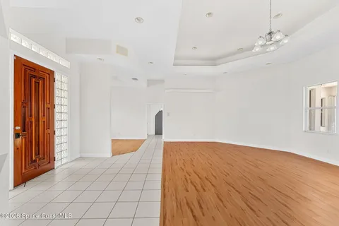 a view of room with window and a ceiling fan