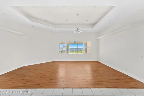 a view of an empty room and a walk in closet
