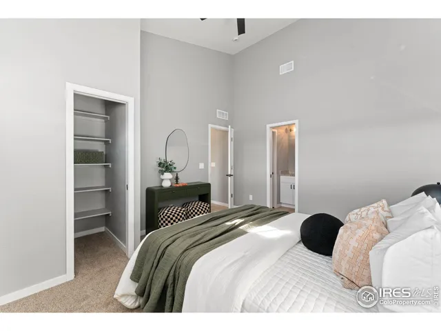 a bedroom with a bed and a cabinets