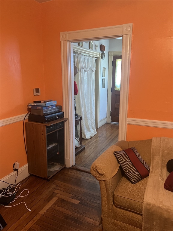 34 Ridlon Road Boston, MA 02136 - Photo 12 of 16 a living room with a couch and wooden floor