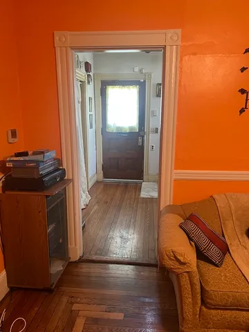 a view of a livingroom with wooden floor