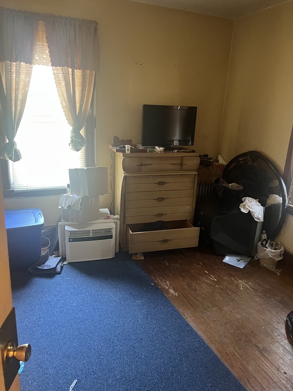 34 Ridlon Road Boston, MA 02136 - Photo 14 of 16 a living room with furniture and a flat screen tv