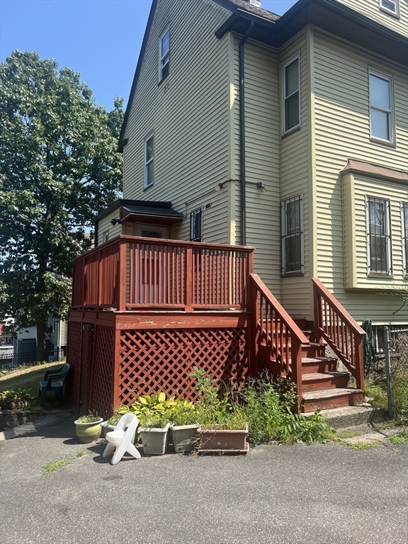 34 Ridlon Road Boston, MA 02136 - Photo 4 of 16 a view of a chair with wooden fence