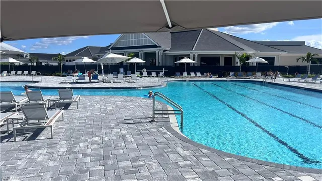 a view of a patio with chairs and tables