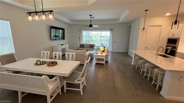 a view of a dining room with furniture window and outside view