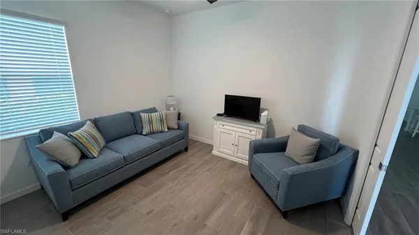 a living room with furniture and a couch