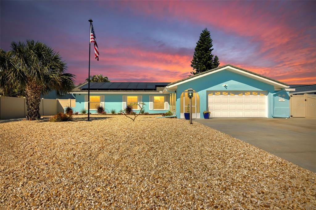 1015 Spindle Palm Way Apollo Beach, FL 33572 - Photo 15 of 78 a front view of a house with a yard and a garage