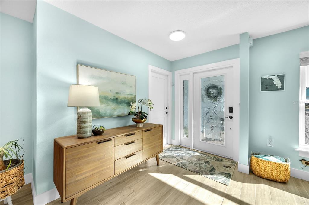 1015 Spindle Palm Way Apollo Beach, FL 33572 - Photo 17 of 78 a bedroom with furniture and a wooden floor