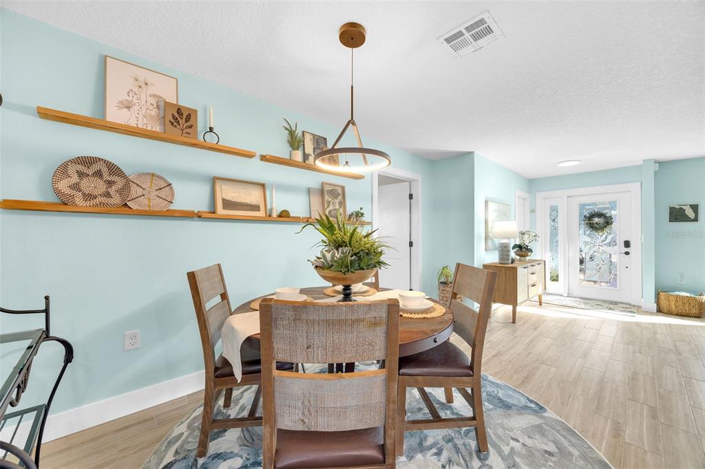 1015 Spindle Palm Way Apollo Beach, FL 33572 - Photo 19 of 78 a dining room with furniture and window