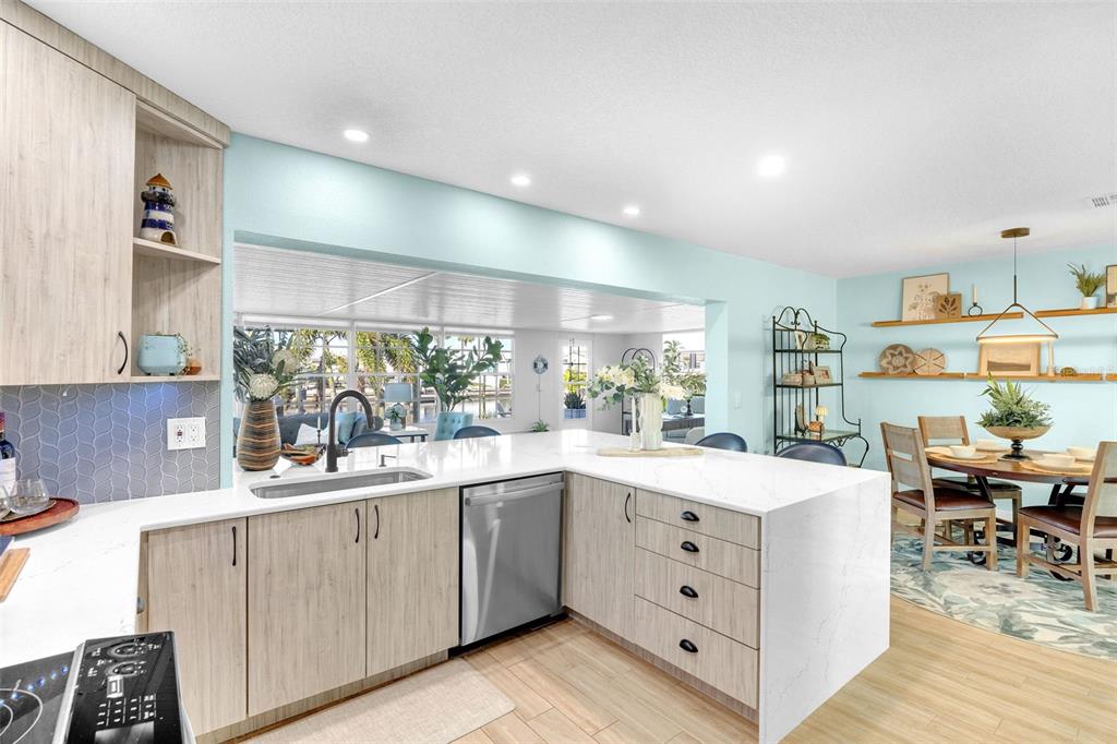 1015 Spindle Palm Way Apollo Beach, FL 33572 - Photo 26 of 78 a kitchen with a sink stove and cabinets