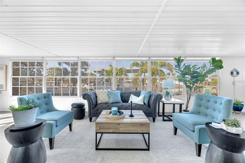 1015 Spindle Palm Way Apollo Beach, FL 33572 - Photo 32 of 78 a living room with furniture and a large window