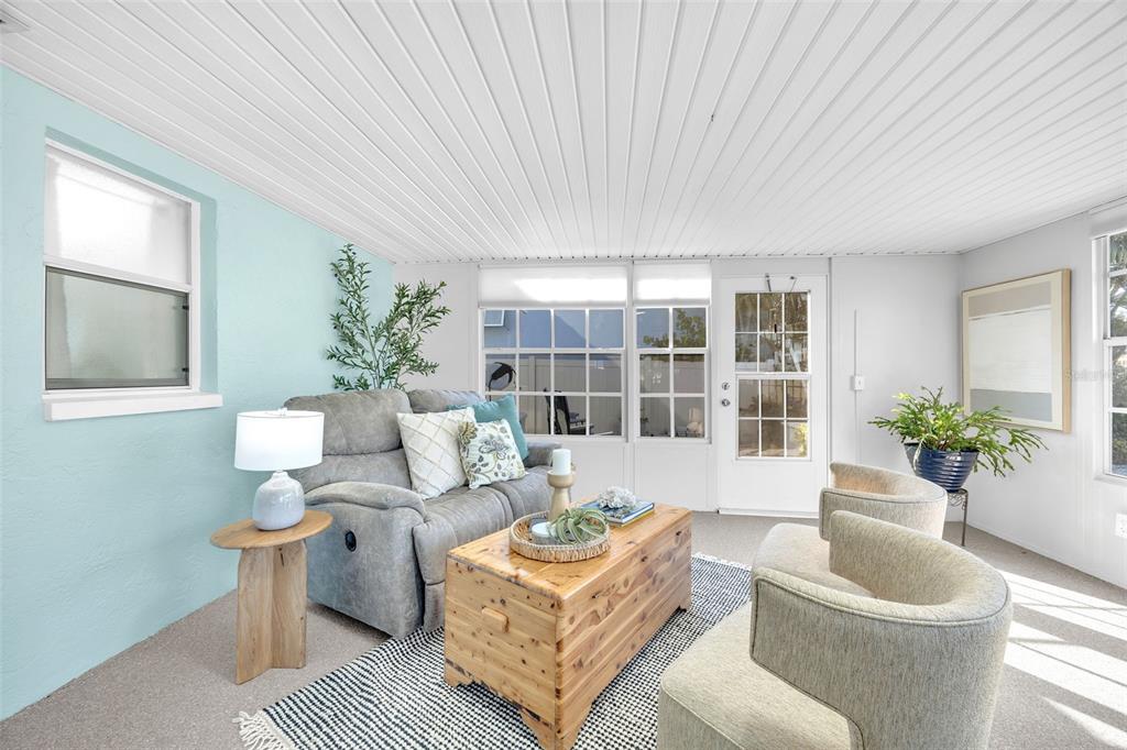 1015 Spindle Palm Way Apollo Beach, FL 33572 - Photo 34 of 78 a living room with furniture and a potted plant