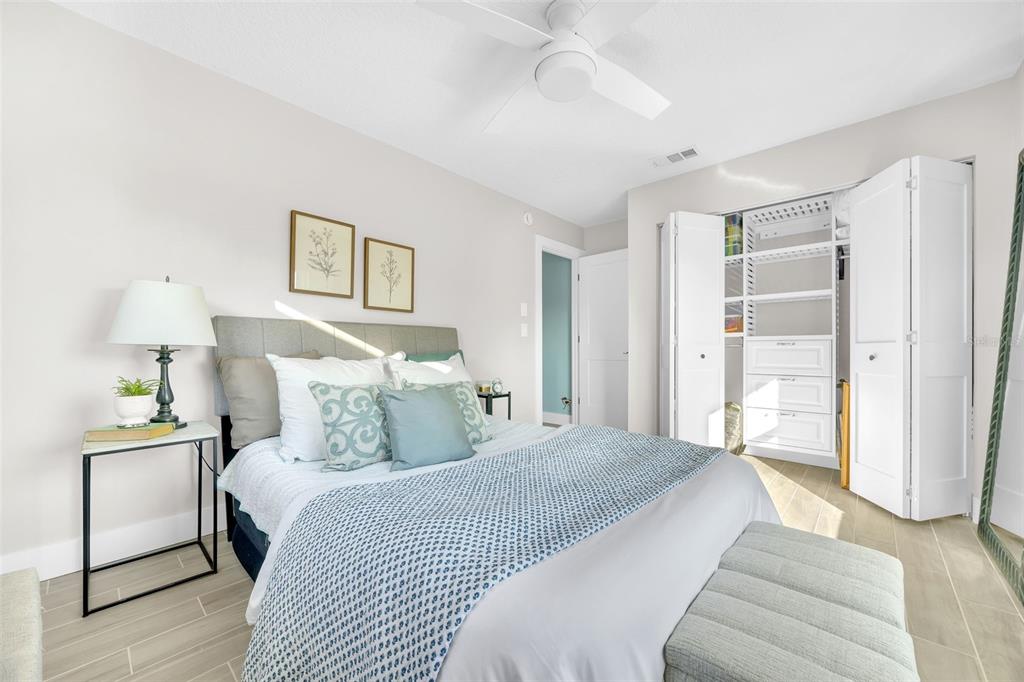 1015 Spindle Palm Way Apollo Beach, FL 33572 - Photo 49 of 78 a bedroom with a bed and a walk in closet