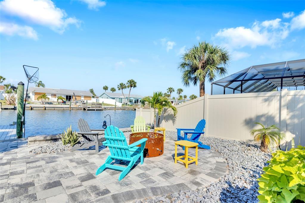 1015 Spindle Palm Way Apollo Beach, FL 33572 - Photo 62 of 78 a backyard of a house with table and chairs