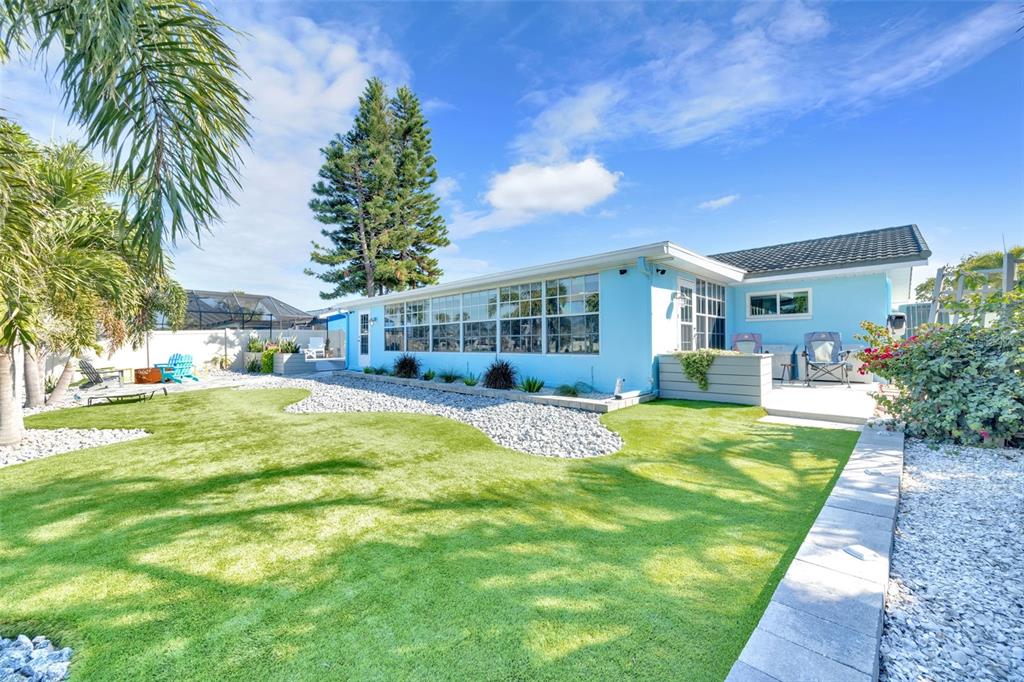 1015 Spindle Palm Way Apollo Beach, FL 33572 - Photo 64 of 78 a swimming pool with outdoor seating and yard