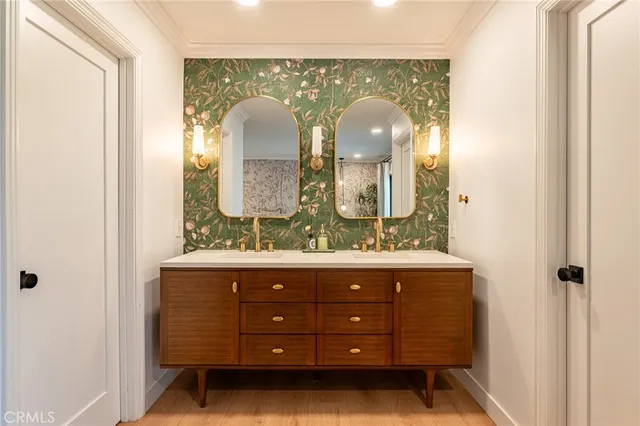 a room with a mirror and vanity