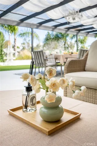 a view of a living room with a floor to ceiling window and a table