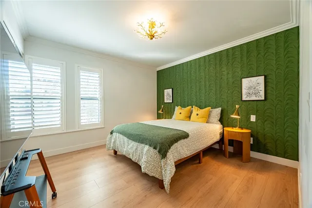 a bed room with a bed and a chair