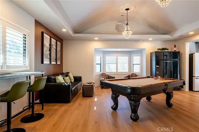 a dining hall with furniture a window and rug