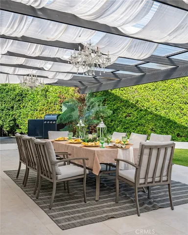 a view of an outdoor space with a table and chairs