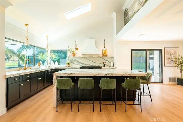 a dining table chairs window and wooden floor