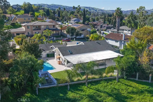 an aerial view of a house with a garden