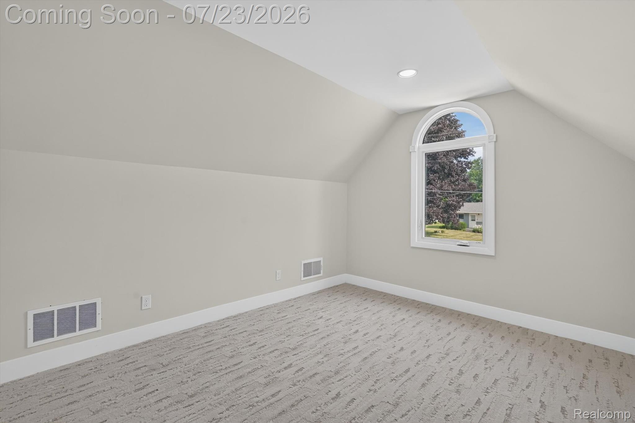 3429 Rolston Road Fenton, MI 48430 - Photo 30 of 62 Carpeted room featuring a large arched window, recessed ceiling light, white baseboards, and wall vents